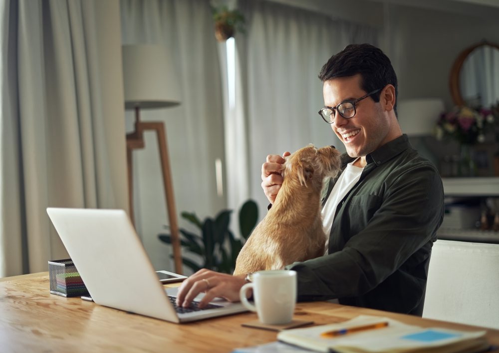 man playing with his dog